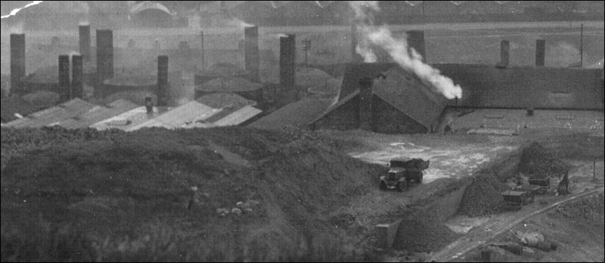 on the left can be seen the typical beehive ovens for firing bricks 