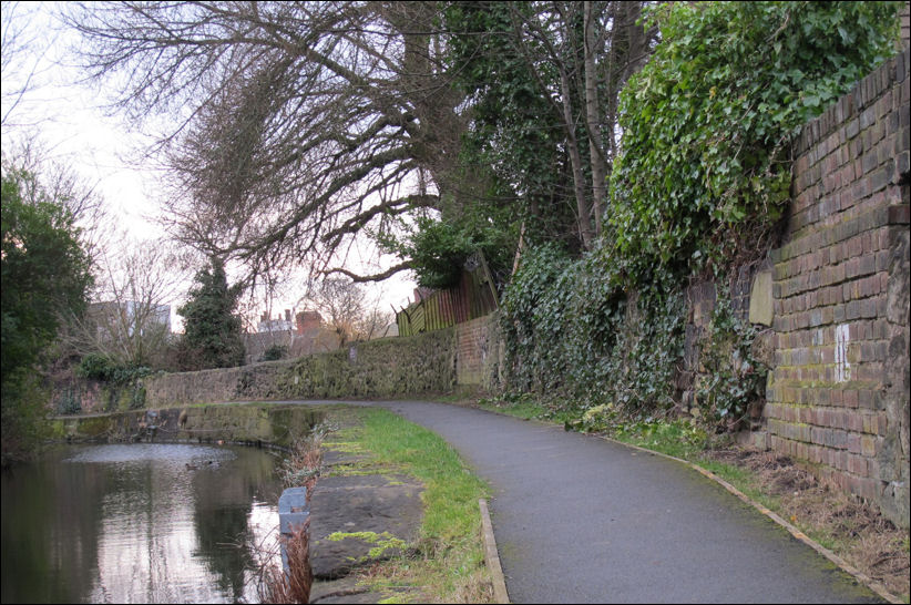 the patchwork of brick & stones in canal side wall reveal the many former gateways to the canal  