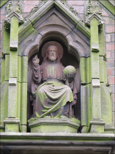 above the side entrance a statue of the Risen Christ in Glory