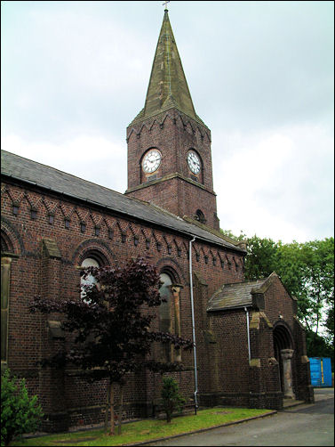 Byzantine Romanesque style, with west tower and spire