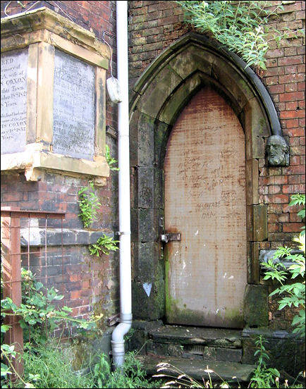 small side door- the mouldings above the door terminates in an old mans head