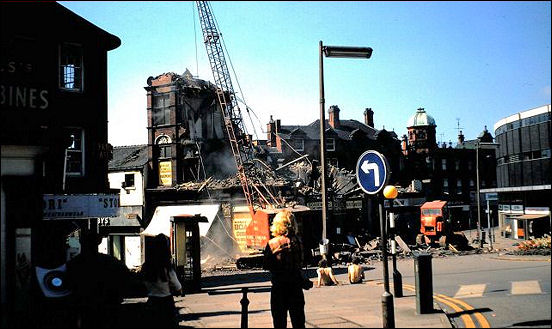 Demolishing the shops in block below Fountain Square (top of Piccadilly).  