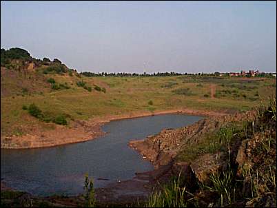 The pool at the bottom of the quarry - in the distance is City Road