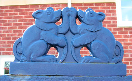 railings surmounted by various stylised animals