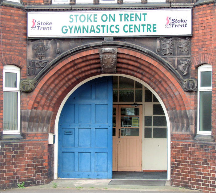 entrance with the date stone and crests 