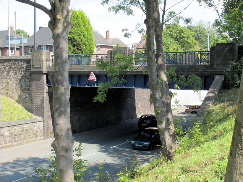 Leek New Road as it goes under the  Holden Bridge 