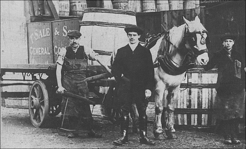 George Sale outside the premises standing in Trubshawe Street with some of the workers