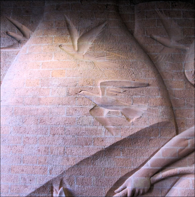 detail of the brick texture on the bottle kiln and the birds 