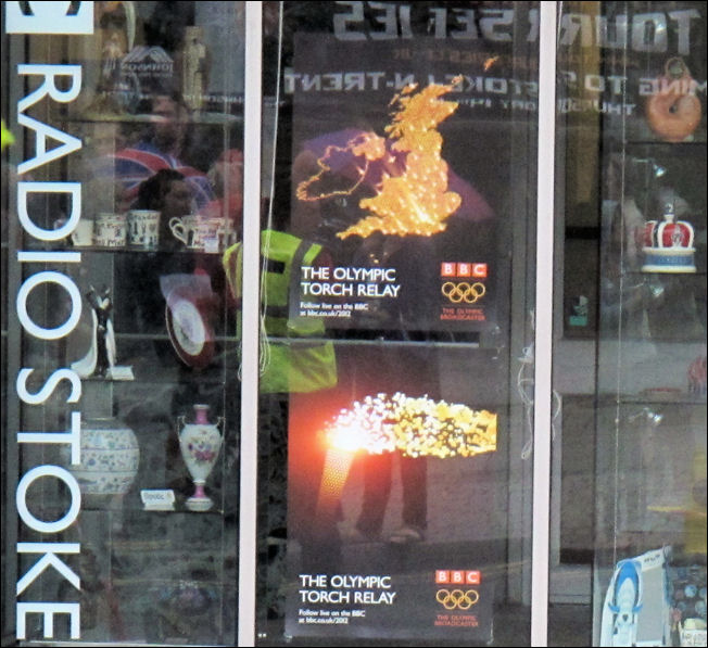 the gathering crowd reflected in the windows of BBC Radio Stoke 