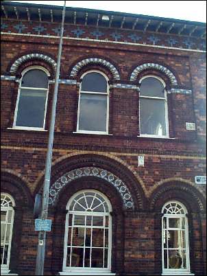 Italianate style building with ornamental brick 