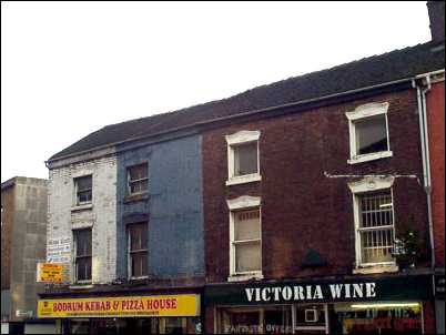 run-down shops on the corner of Market Place and Market Passage