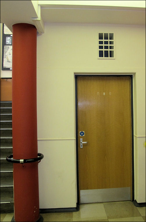 storeroom to the side of the main stairs 