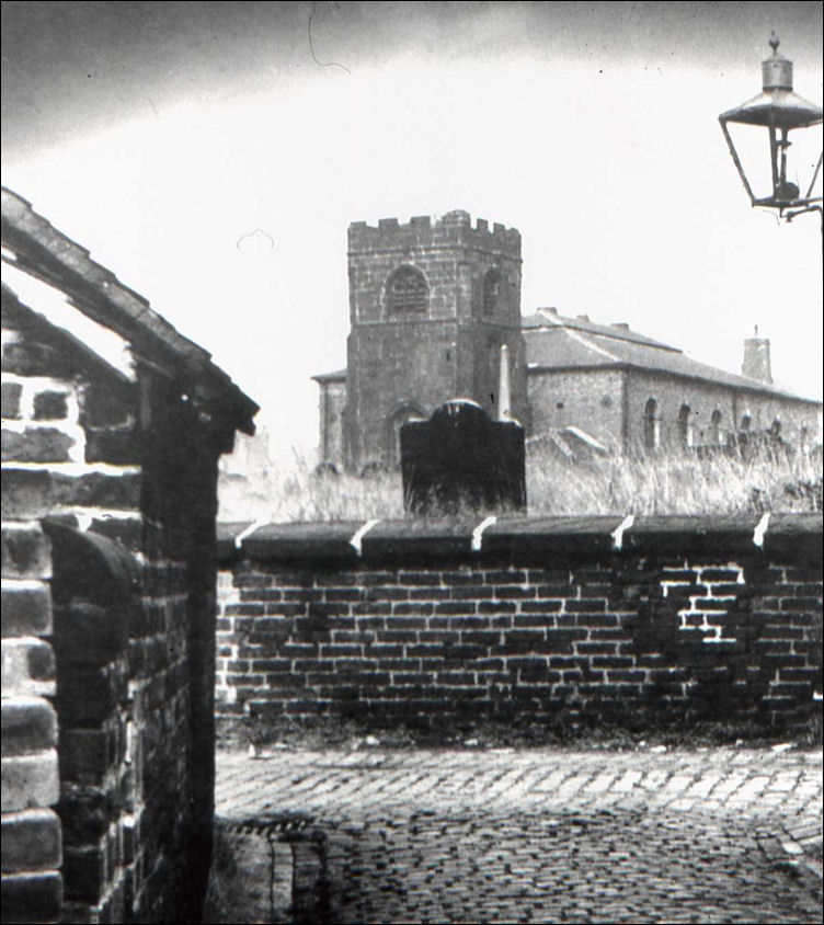 The short and humble stone tower is the only remaining Norman part of the church