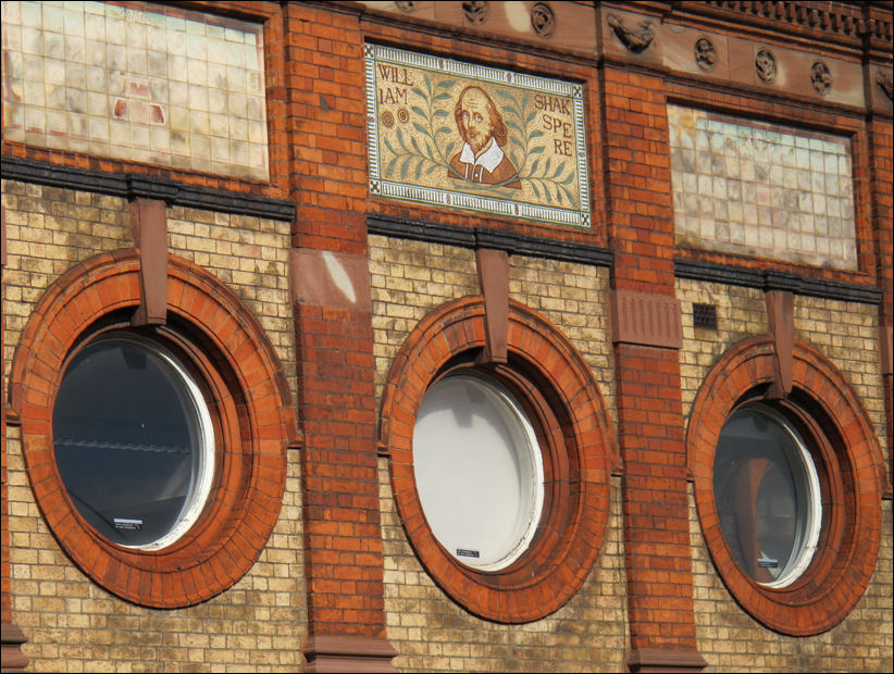 "The most interesting features are the circular windows on the upper ground floor and the Shakespeare mosaic on the facade"