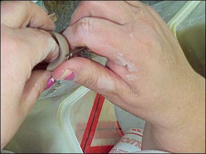 Fettling the handle to remove the joint line from the mould